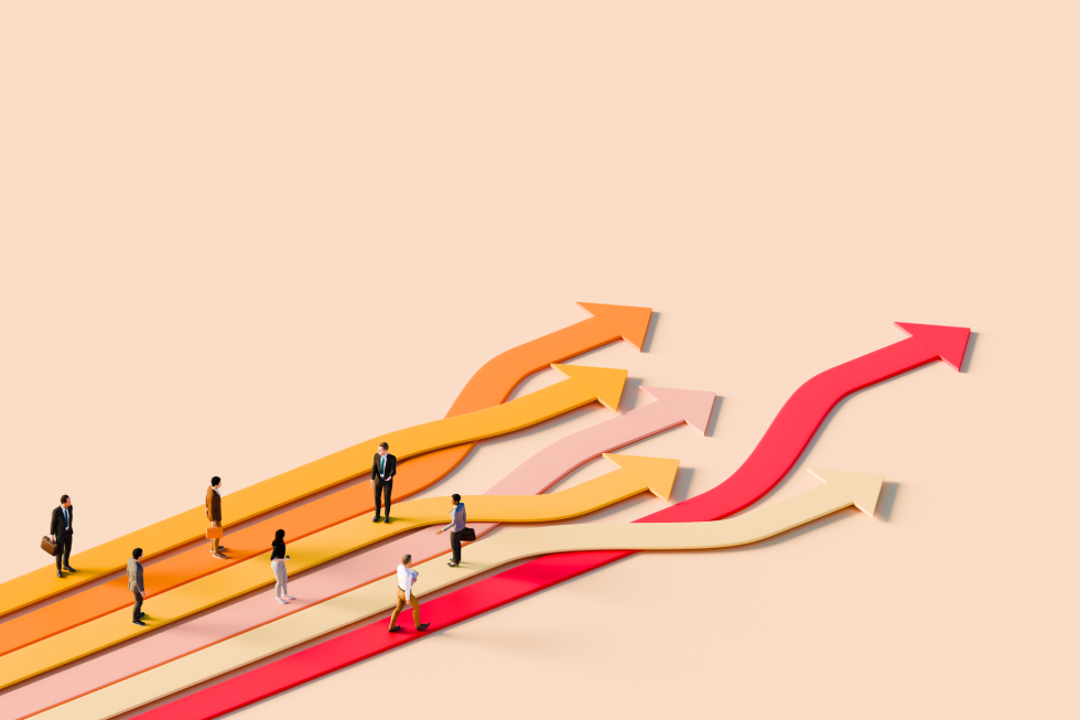 Coaching Picture People walk along multi-colored arrows rising upward, symbolizing growth and progress.